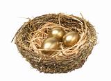 Three golden hen's eggs in the bird's nest isolated on white 