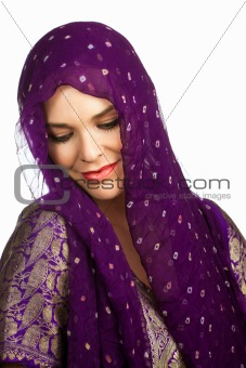 Beautiful young Indian or Asian woman wearing a head scarf