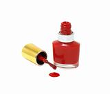 Spilled Red Nail Polish with brush isolated on white