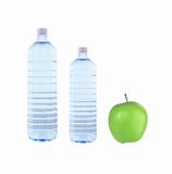 Bottles of water and green apple isolated on white background