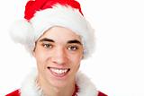 Attractive male teenager dressed as santa claus smiles happy