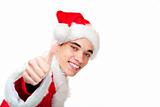 Smiling male santa claus teenager shows thumb up