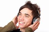 Male Teenager listening to music via headphone and sings