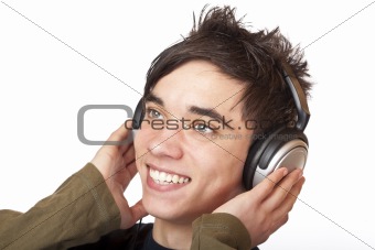 Male Teenager listening to music via headphone and sings