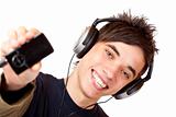 Happy male Teenager with headphones shows mp3 music player