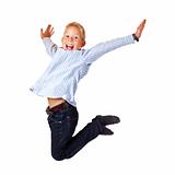 Happy sportive boy jumps with spread arms in the air