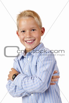 Portrait of young smiling boy with crossed arms