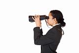 Woman with binoculars searching for business in the future