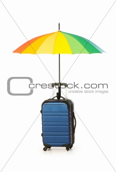 Travelling concept with case and umbrella on the white