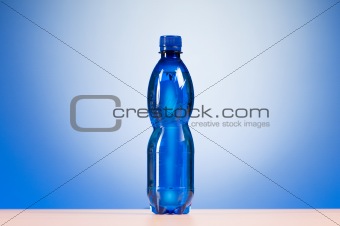 Bottle of water against colorful gradient background
