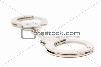 Metal handcuffs isolated on the white background