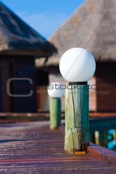 Lantern on the pier of tropical island