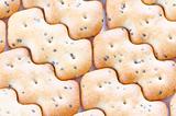 Shaped browned crisp biscuits as tile background