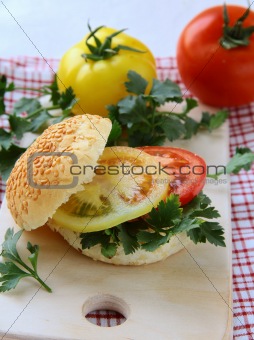hamburger with tomatoes and parsley