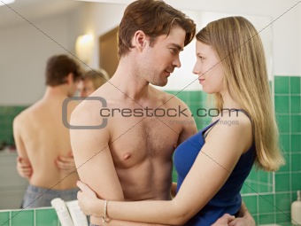 young heterosexual couple in bathroom