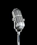 Vintage microphone isolated on black background 