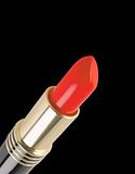 Red lipstick isolated on black background