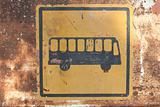 Rusty bus stop sign