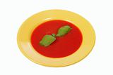tomato soup in yellow plate