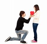 Asian young Man handing over love gift  to  young woman on Valentine Day