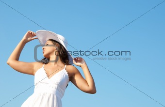 Girl in the blue sky with hat