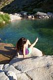 woman sitting in a lake at Gredos