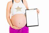Pregnant woman holding blank clipboard.  Close-up.
