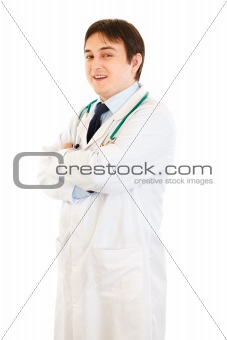 Smiling young  doctor with crossed arms on chest
