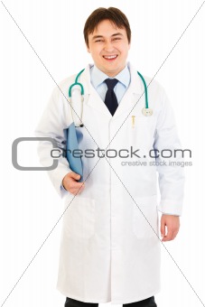 Pleased  doctor holding medical chart in hand
