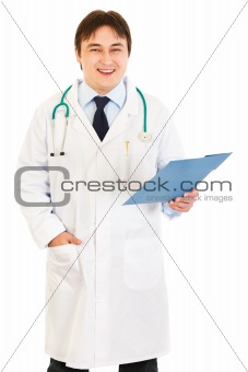 Pleased  doctor holding medical chart in hand
