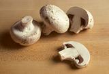 White mushrooms on a cutting board