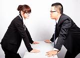 Businessman and woman war in office