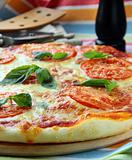 Margarita pizza with tomatoes and basil cheese