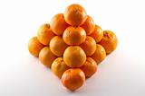 Clementines arranged in a pyramid shape