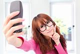 Young asian woman take photo by her cell phone