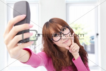 Young asian woman take photo by her cell phone