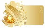 Gold ribbon and jewel on beige background