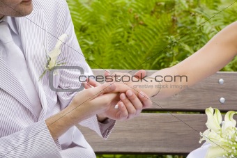 Fiance takes bride's hand