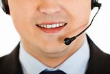 Smiling modern businessman with headset. Close-up.
