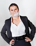 Businesswoman blowing bubblegum