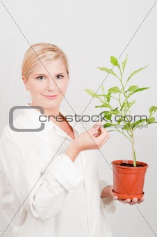 pretty female botanic scientist with plant
