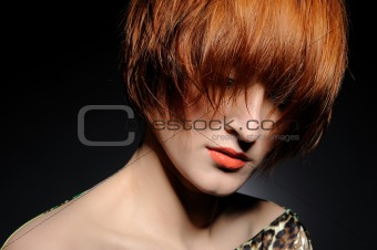 Beautiful red heaired woman portrait with fashion hairstyle