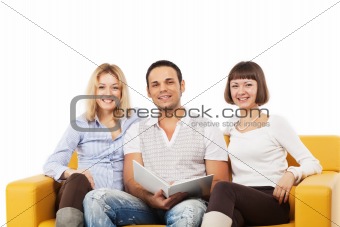 Smiling young people sitting together