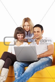 Three friends with laptop computer