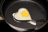 Fried egg in iron form heart