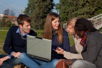 College Students with Computer at Park