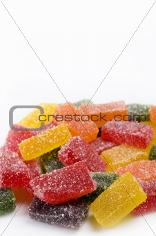 delicious sweet candies in sugar. white background