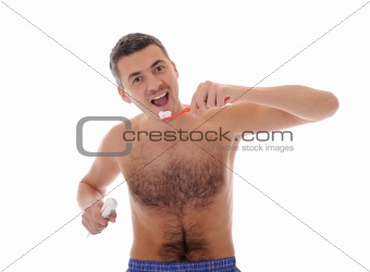 Middle aged man brushing his teeth in the morning. isolated