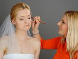 Natural Wedding make-up is being applied to pretty bride.