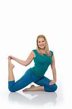 Beautiful happy woman doing pilates pose. isolated on white
